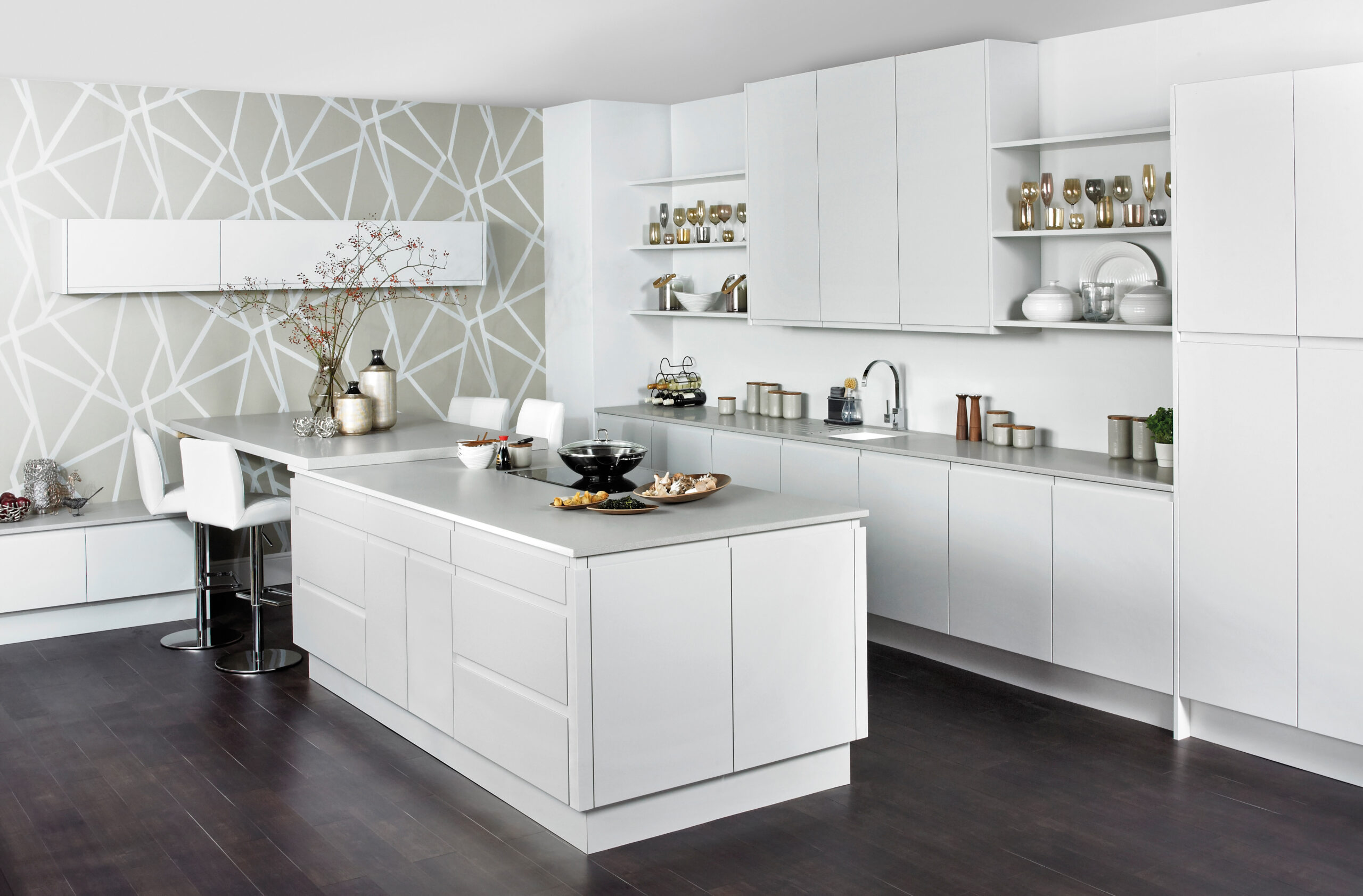 white kitchen island design with grey worktops , base and wall cabinets to rear with sink and hob