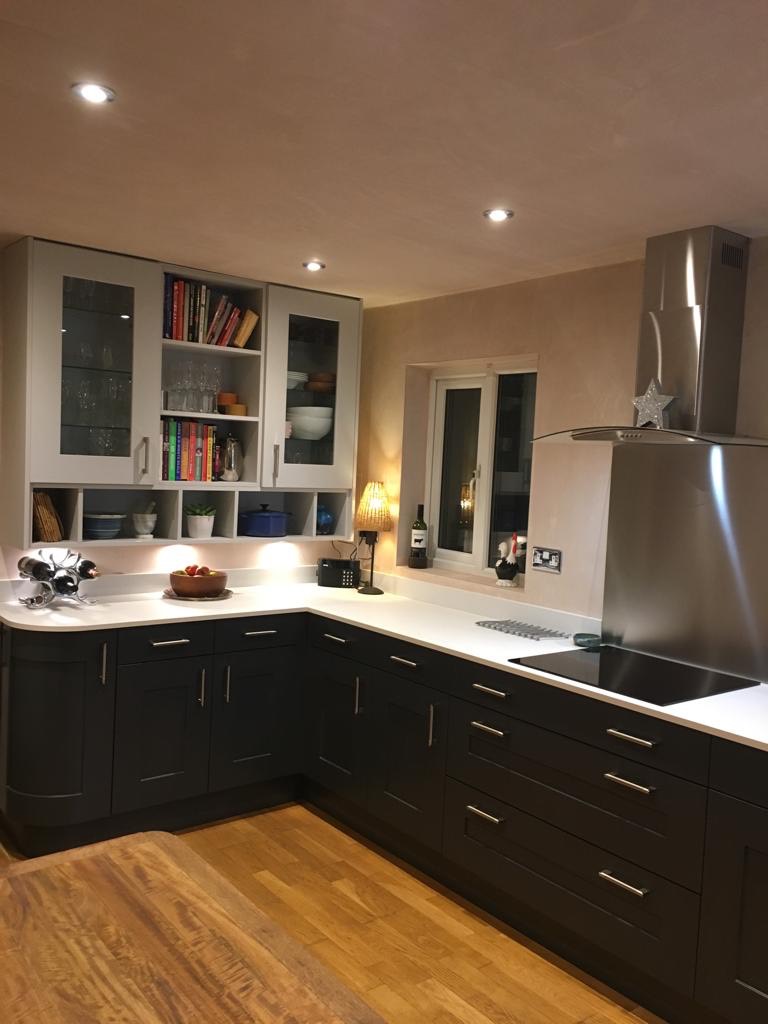 ebony fitted kitchen in Teesside with light quartz tops an da hob and extractor, Customer,