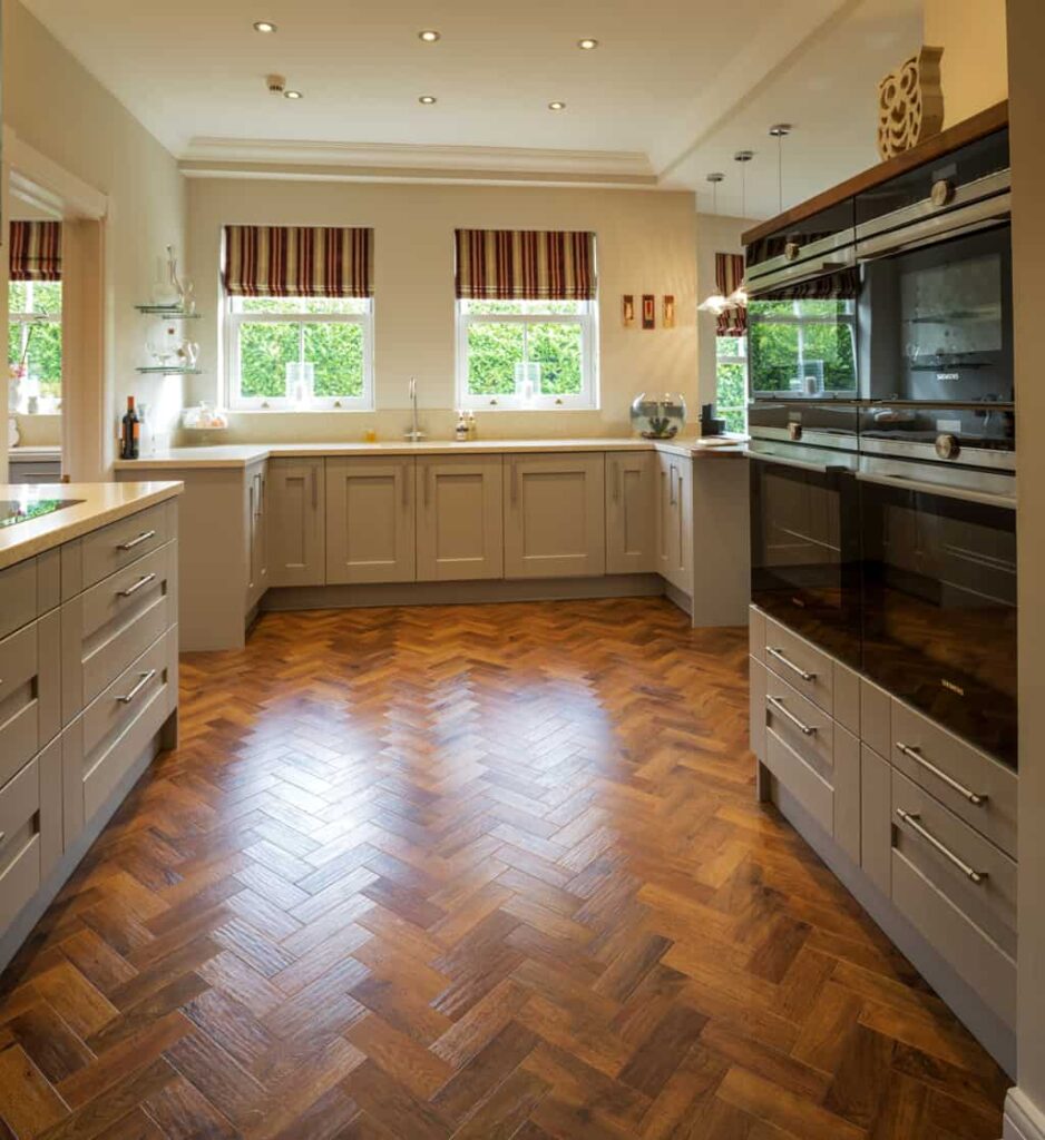 two tall oven towers on right and sink cabinets to background